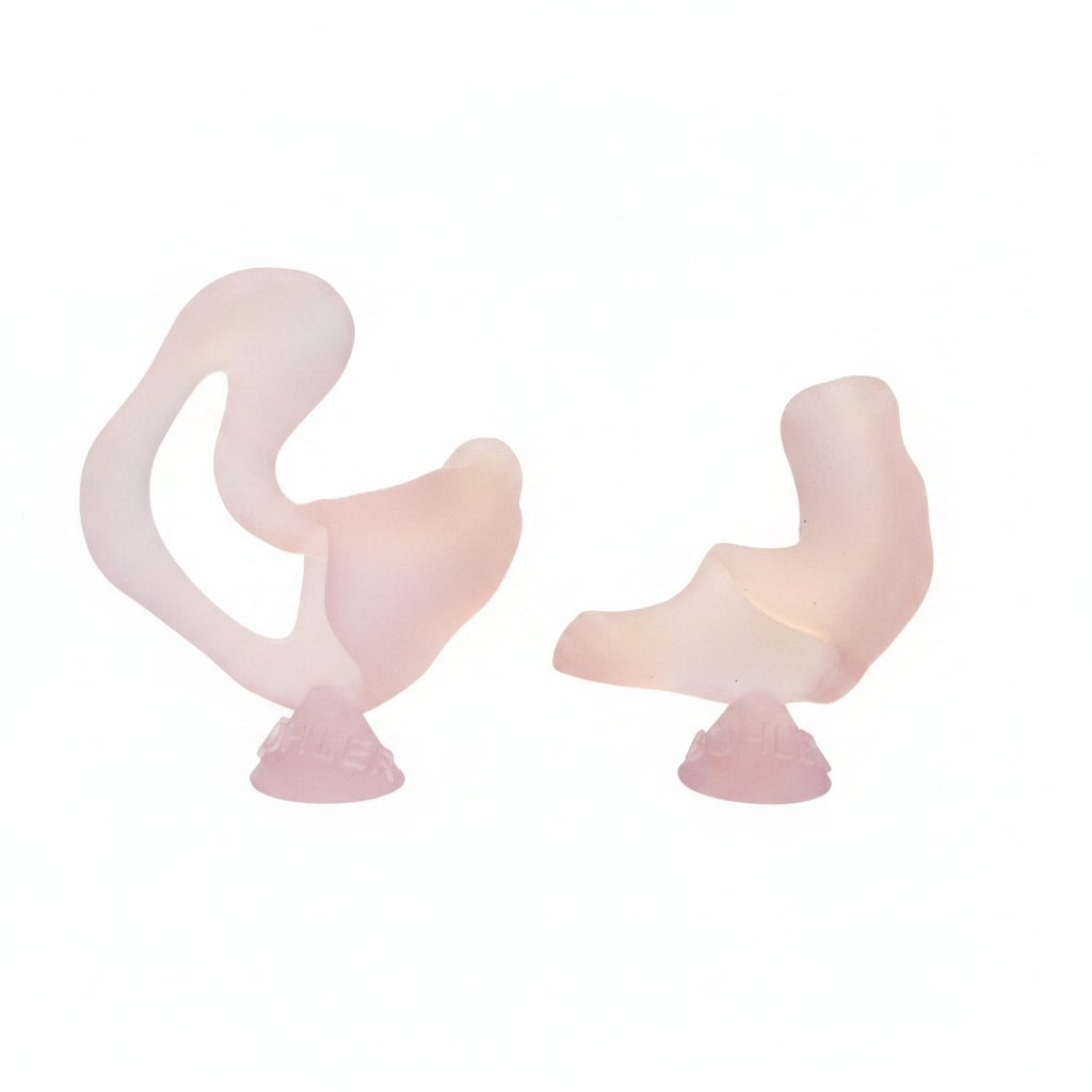 A pair of translucent pale pink sculptural objects with curved, abstract shapes and small pedestal bases, photographed against a plain light background.